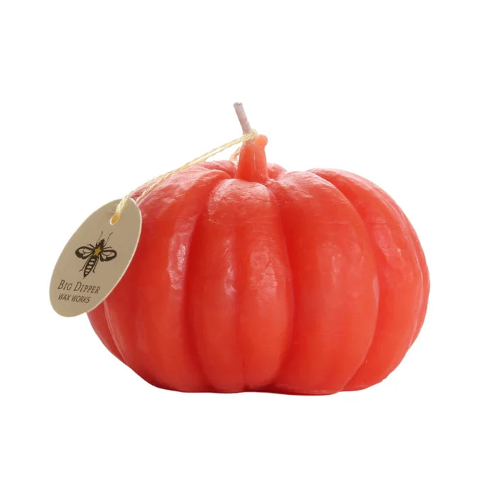 Big Dipper Wax Works Small Beeswax Pumpkin Candle in dark orange-red, unlit product shot against a white background, showing a squat ribbed pumpkin form with a short wick at the top and a round oval Big Dipper Wax Works hang tag tied with twine